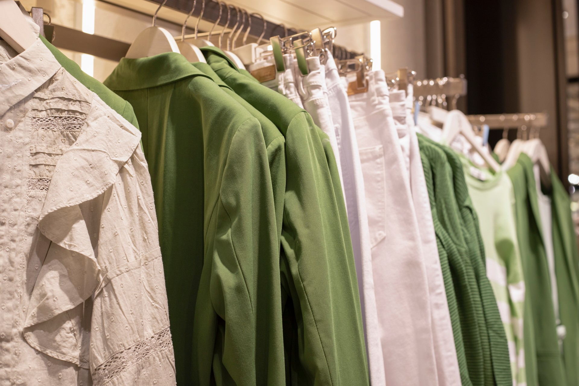 Women clothing collection on hangers in the store. the concept of conscious consumption and recycling of things